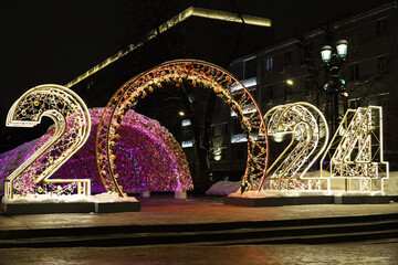 New Year decorations on a night city street with big numbers 2024. Festive illumination, Christmas...