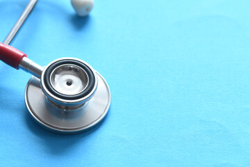 Stethoscope on blue background. Heart health, health insurance concept, world heart day, world...