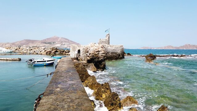 view of old fortress and old town in Naoussa, Paros island, Greece