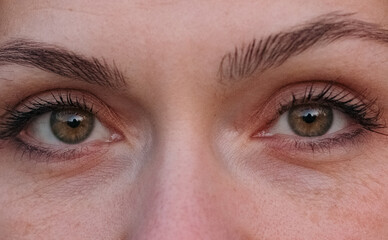 Close-up view to young woman eyes.