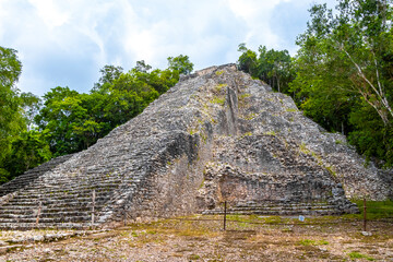 Coba Maya Ruins Nohoch Mul pyramid in tropical jungle Mexico.