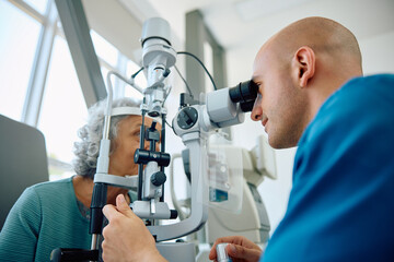 Senior woman having her eyes checked by ophthalmologist.