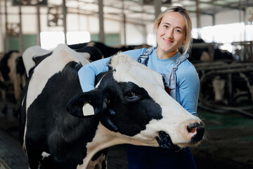 Portrait Farmer Happy young woman hugging cow, concept veterinary health care. Concept agriculture...