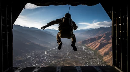 Fototapeten Airborne soldier with parachute on back jumps out of plane at sunrise light. Paratrooping military forces officer practices for mission. Trained man dives in open air from army airplane board © Stavros