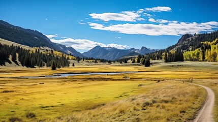 Obraz premium In autumn, the mountain range is dotted with forests and meadows