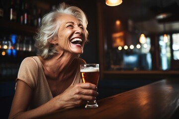 lady laughing while drinking her rye beer at bar - obrazy, fototapety, plakaty