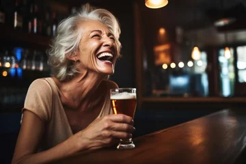 Foto op Plexiglas lady laughing while drinking her rye beer at bar © Sergey