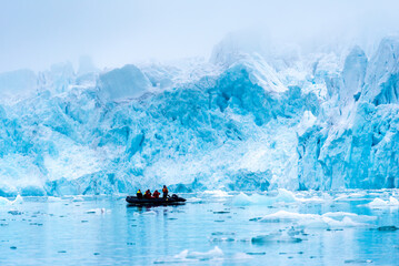 A group of tourist visiting a glacier in Svalbard