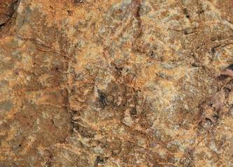 Red brown rock natural texture for background. Close up cracked mountain surface.