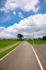 Blue sky and white clouds, river park, bicycle lane, bicycle, exercise