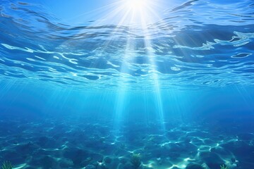 Obraz premium An underwater view of the ocean with sunlight shining through the water