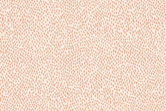 Contemporary orange polka dot pattern on white background. Irregular chaotic small circles. Peach fuzz - color of 2024 year. Modern exotic design for print paper, card, banner, wallpaper, textile, 