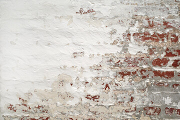 Red brick wall with white plaster, brickwork. Old grunge white painted brick wall texture background. Loft style wall. White brick Industrial abstract background for photos, fabrics, textiles, papers