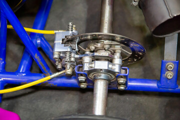 The braking system of racing car with a disc and control rods. Cars, racing, competitions.