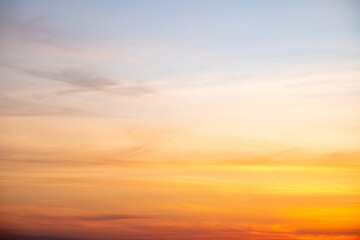 Beautiful of luxury soft gradient orange gold clouds and sunlight on the blue sky perfect for the background, take in everning,Twilight
