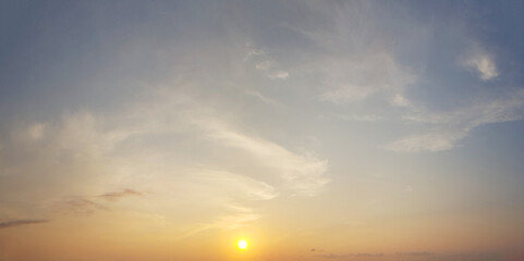 Sunrise sky. Light cloud and sun on blue sky background