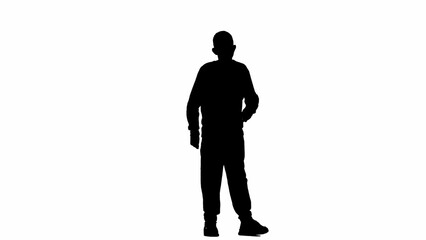 Portrait of kid boy isolated on white background with alpha channel. Silhouette of schoolboy standing posing at the camera with hand on waist.