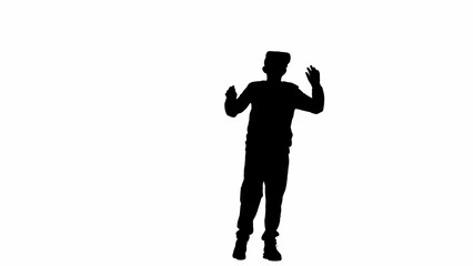 Portrait of kid boy isolated on white background with alpha channel. Silhouette of schoolboy in virtual reality glasses holding hands up amazed.