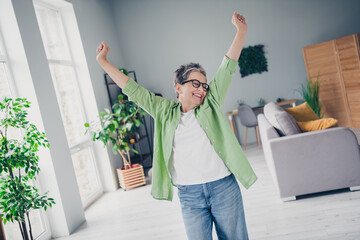 Photo of attractive intelligent elderly businesswoman raised fists up celebrate triumph ending...