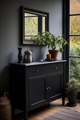 mirror with a black dresser at the entrance