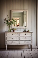 mirror with a white dresser at the entrance