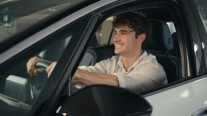 Happy smiling customer Caucasian business man sitting inside new car smile client buyer male driver owner guy in luxury vehicle in automobile salon store auto rent transport buying take bunch of key