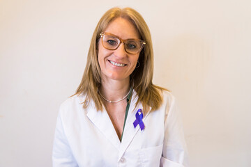 Female doctor using breast cancer awareness ribbon.