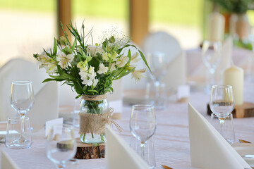 White flowers decorated on the table for event party or wedding reception - 689727664