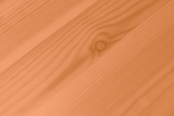 Peach Fuzz color wood texture monochrome background. Wood texture with natural pattern. Color of the year 2024.