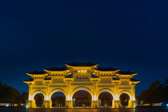 Gate of Chiang Kai Shek Memorial Hall in night, Tapiei, Taiwan. Chinese text on the archway meaning is "Liberty Square".
