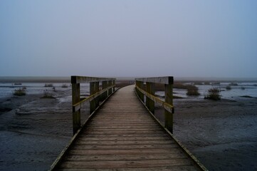 Fototapeta na wymiar A lonely wooden pier in the sea 