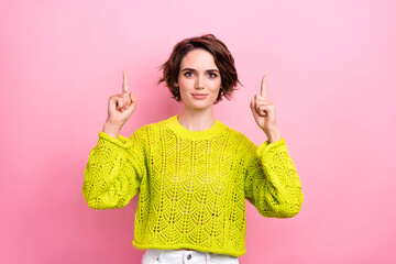 Portrait of young girl dressed stylish yellow clothes point fingers up introduce billboard new...