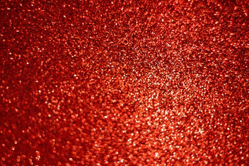 Red bokeh. Defocused abstract red background, holiday concept