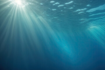 Underwater ocean - blue abyss with sunlight - diving and snorkeling. Mesmerizing sun rays beneath the ocean surface