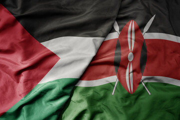 big waving national colorful flag of kenya and national flag of palestine .