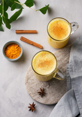 Turmeric golden milk latte with spices and honey. Detox, immunity boosting, anti-inflammatory, healthy, cozy drink