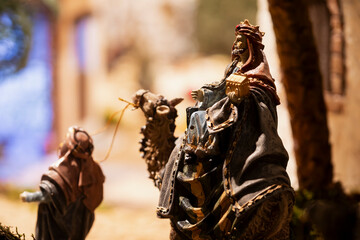 Figurine of the wise man Melchior on a camel nativity scene figures, in a nativity scene, in Borja, Zaragoza, Spain
