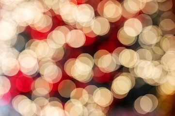 Christmas blurred background. Christmas tree decorated with garlands is out of focus.