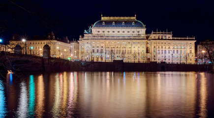 Prague at night, the capital, National Theater in the reflection of the Vltava