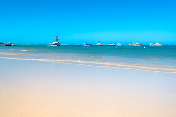 Fototapeta na wymiar Boats and yachts at Bavaro Beach in Punta Cana, Dominican Republic