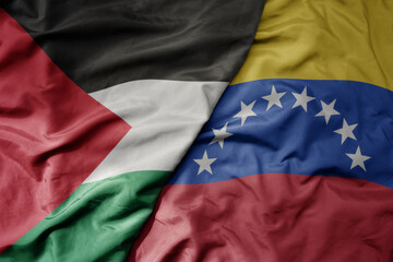 big waving national colorful flag of venezuela and national flag of palestine .