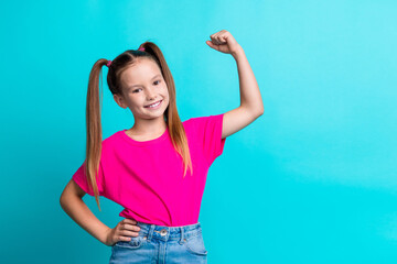 Photo of glad adorable cute girl wear stylish pink clothes showing muscular arm empty space...