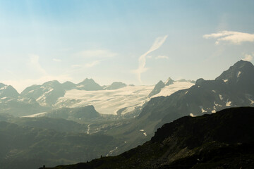 Fototapeta premium Summer Splendor: Peaks, Ice, Rocks, and Lakes. Alps. Aosta Valley. Italy.