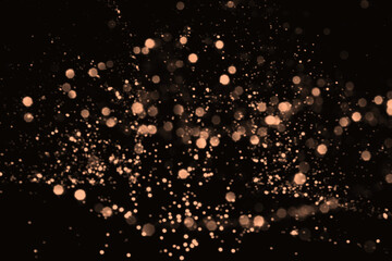 Peach fuzz blurred abstract bokeh lights on black background. Snowy shiny glitter sparkle stars for celebrate