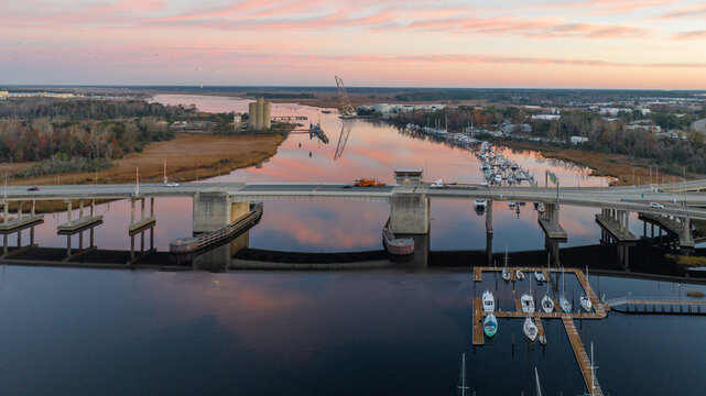 Cape Fear River with the Isabel Holmes Bridge in the back during a sunrise. 