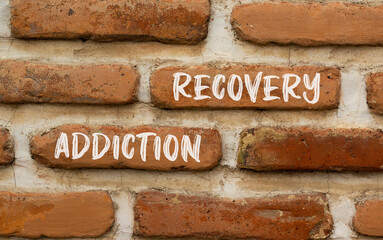 Addiction recovery symbol. Concept words Addiction recovery on beautiful brown brick wall....