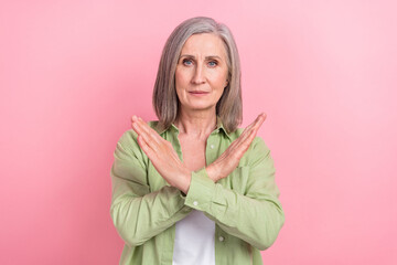Photo of sad upset senior lady wear stylish green clothes two hands crossed stop ageism bullying...