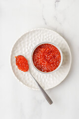 red caviar in a metal jar