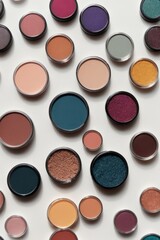Top view of a lot of colorful eye shadow on a white background. Cosmetics and beauty concepts.