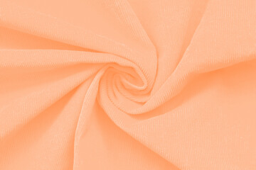 Textured background trendy color of 2024 peach fuzz.